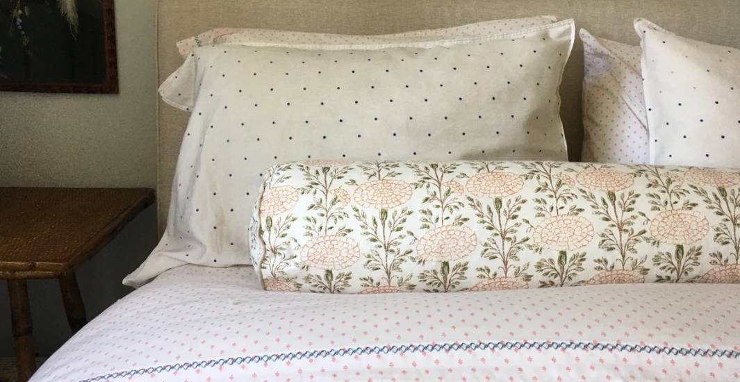 round bolster pillow in interior supports square pillows