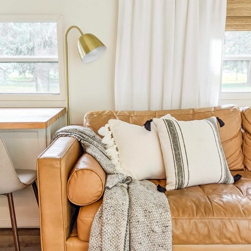 light beige throw pillows in boho style for a light brown sofa
