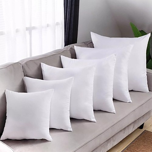 pillows in different sizes on a sofa