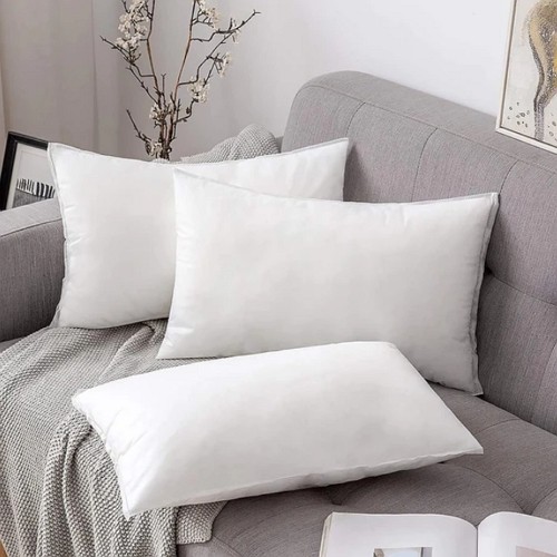 a set of three rectangular pillows in the same size