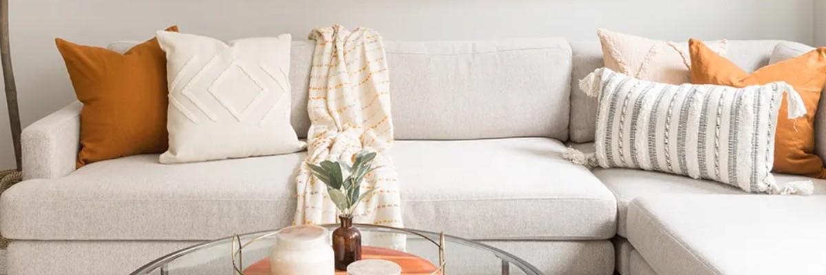 yellow and orange square pillows and bolsters
